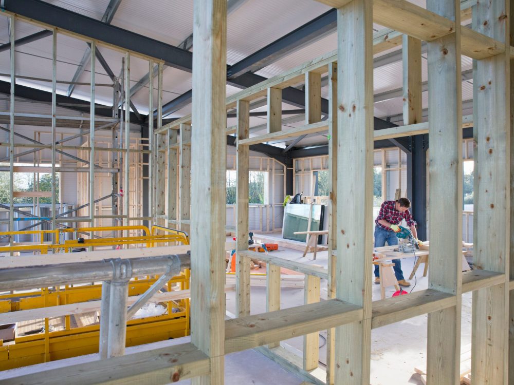 building-construction-site-interior-with-carpenter-2026-01-11-09-48-26-utc